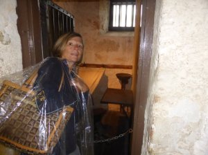 Jane in her exclusive plastic poncho outside a 7x4 cell....not going in there!
