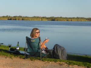 Enjoying a glass of red lakeside