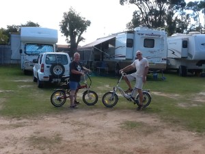 The boys on the bikes in front of our rigs