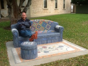This concrete and mosaic seat and foot stool in town appealed - note the woolly jumper, the 3rd layer