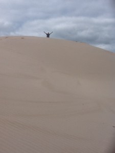 Steve at the top of a sand dune