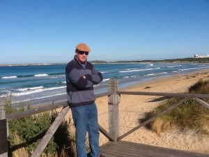 On the Promenade and the town beach looking around to the harbour breakwater